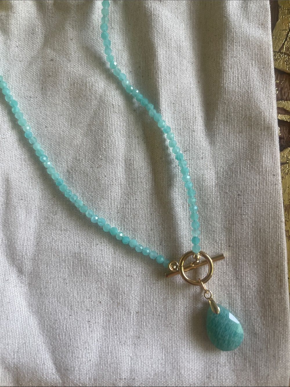Teal Faceted Bead Necklace with Teardrop Pendant